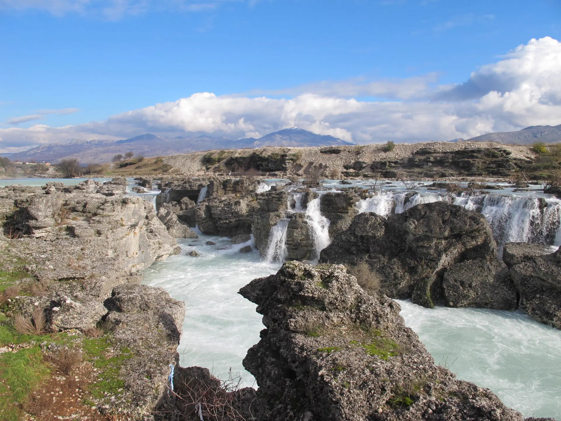 Waterfalls running across a rocky Montenegrin riverbed